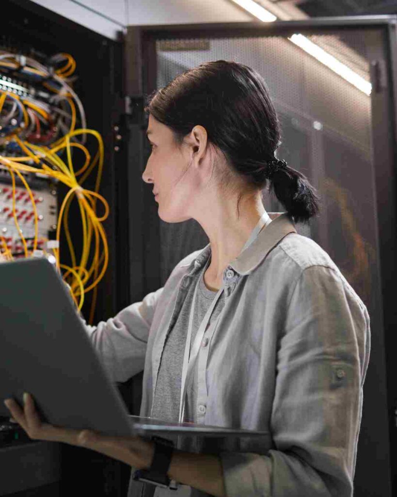 Person working on server equipment.